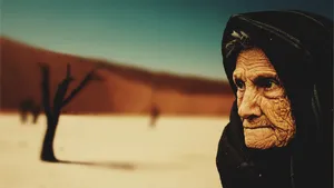 Beautiful Older Woman In Desert Wallpaper