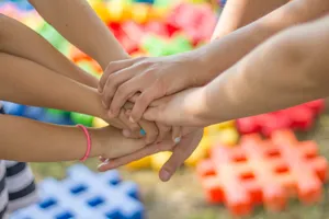Beautiful Shot Of Children Friends Put Their Tangible Hands Together Wallpaper