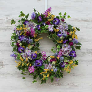 Beautiful Spring Wreath On A Wooden Door Wallpaper