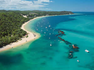Beautiful Sunrise Over The Calm Shores Of Bali Island Wallpaper
