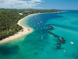 Beautiful Sunrise Over The Calm Shores Of Bali Island Wallpaper