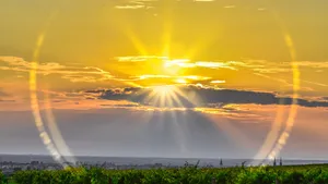 Beautiful Sunset Skies Above A Sprawling Cityscape Wallpaper