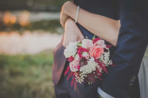 Beautiful Wedding Bouquet With Roses And Greenery Wallpaper