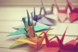 Beautifully Orchestrated Colorful Cranes Wallpaper