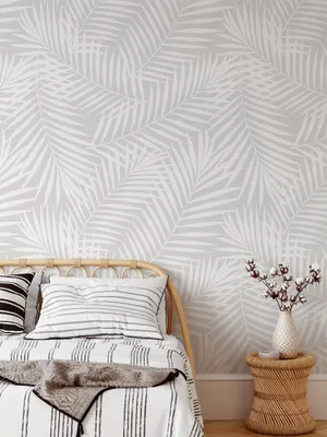 Bed Captured Against A Wall With Subtle Design Wallpaper