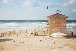 Beige Lifeguard Station Beach Aesthetic Wallpaper