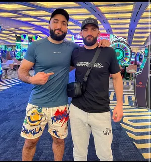 Belal Muhammad Posing With Friend Wallpaper