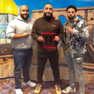 Belal Muhammad Posing With His Friends Wallpaper