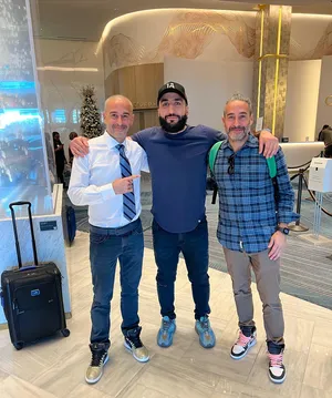 Belal Muhammad Posing With Two Men Wallpaper