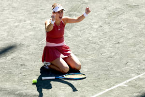 Belinda Bencic Kneeling On Court Wallpaper