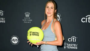 Belinda Bencic With Large Tennis Ball Wallpaper