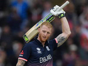 Ben Stokes With Wooden Cricket Bat Wallpaper