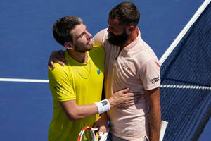 Benoit Paire And Cameron Norrie Sharing An Embrace After A Tennis Match. Wallpaper