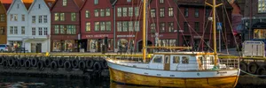 Bergen Bryggen Waterfrontwith Boat Wallpaper