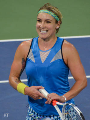 Bethanie Mattek-sands Showing Her Vibrant Personality With A Beaming Smile. Wallpaper