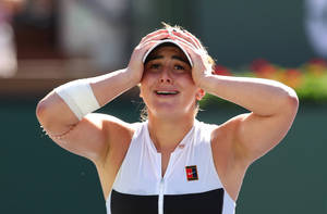 Bianca Andreescu Holding Head In Hands Wallpaper