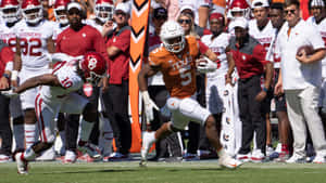 Bijan Robinson Texas Longhorns Football Action Wallpaper