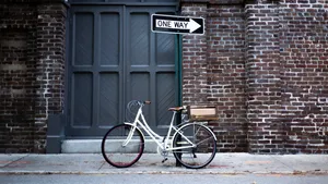 Bike Riding On Old Downtown Streets Wallpaper