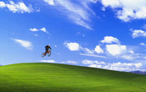 Biker_on_ Windows_ X P_ Bliss_ Hill.jpg Wallpaper