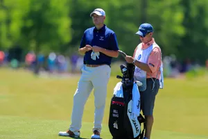 Bill Haas Standing With His Caddie Wallpaper