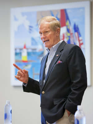 Bill Nelson Speaking With One Raised Finger Phone Wallpaper