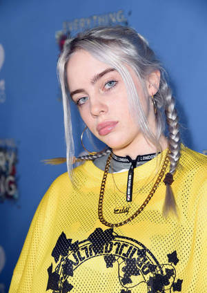 Billie Eilish Dressed In Her Signature Style Wallpaper