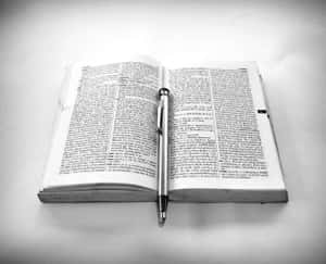 Black And White Book On A Table In A Library Wallpaper