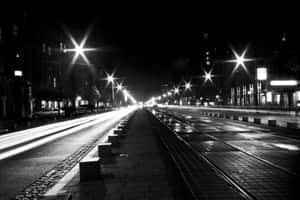 Black And White Street Scene In A Bustling City Wallpaper