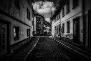 Black And White Street With A Person Crossing Wallpaper