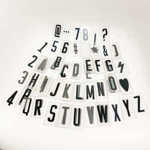 Black And White Typography Art Featuring A Letter Wallpaper