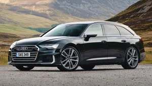 Black Audi Station Wagon Mountain Backdrop Wallpaper