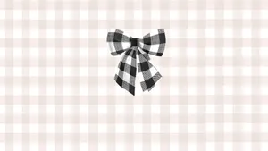 Black Bow On Plaid Background Wallpaper