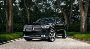 Black Dodge Durango Luxury S U V Parked Outdoors Wallpaper