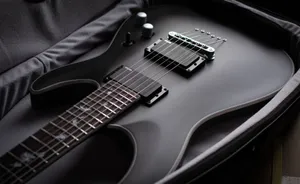 Black Electric Guitarin Case Wallpaper