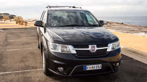 Black Fiat Freemont Parked By The Sea Wallpaper