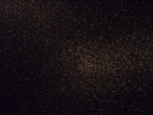 Black Glitter Subtle Gold Glow Wallpaper