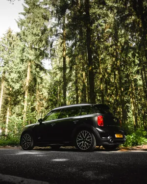 Black Hatchback Wide Road Wallpaper