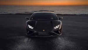 Black Lamborghini Sunset Coastline Wallpaper