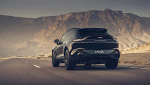 Black Luxury S U V Desert Drive.jpg Wallpaper