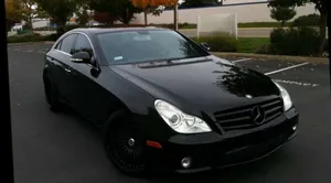 Black Luxury Sedan Parked Outdoors Wallpaper