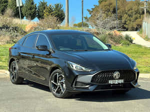 Black M G5 Sedan Parked Outdoors Wallpaper