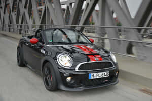 Black Mini Roadster On Bridge Wallpaper