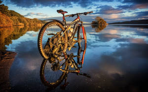 Black Mountain Bike Near River Wallpaper