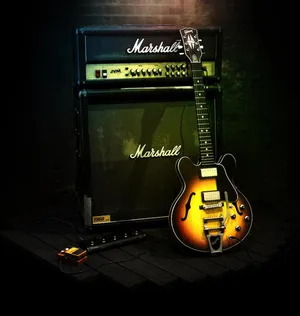 Black Orange Gibson 335 With Amplifier Wallpaper
