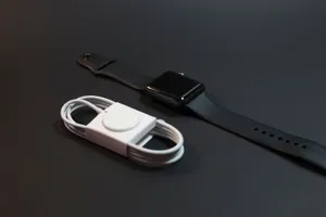 Black Smartwatch With Charging Cable Wallpaper