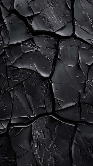 Black Textured Surface Cracks Wallpaper