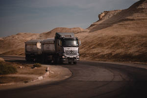 Black Truck At Mountain Road Wallpaper