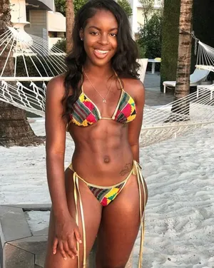 Black Woman In Bikini Tongue Wallpaper