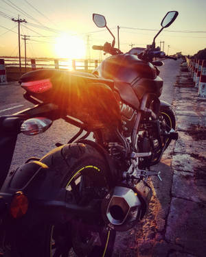 Black Yamaha Mt 15 Over Sunset Wallpaper