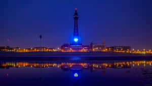 Blackpool Tower At Night With Blue Light Wallpaper